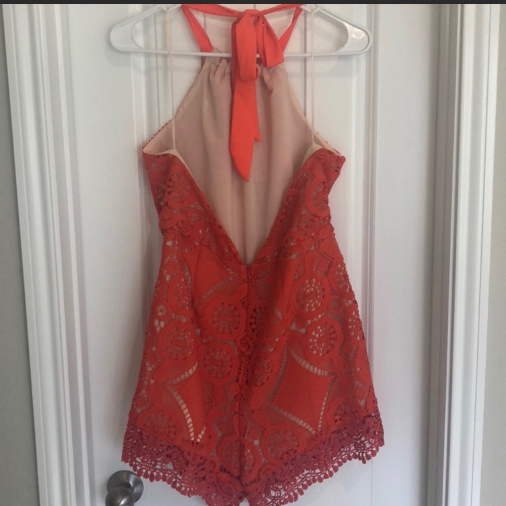 Coral lace Sugar Lips romper with open back. - Picture 2 of 2